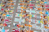 photo of paper chain dolls